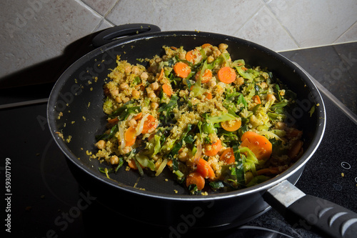 Detail of cooking vegetables in a pan, healthy and organic food.