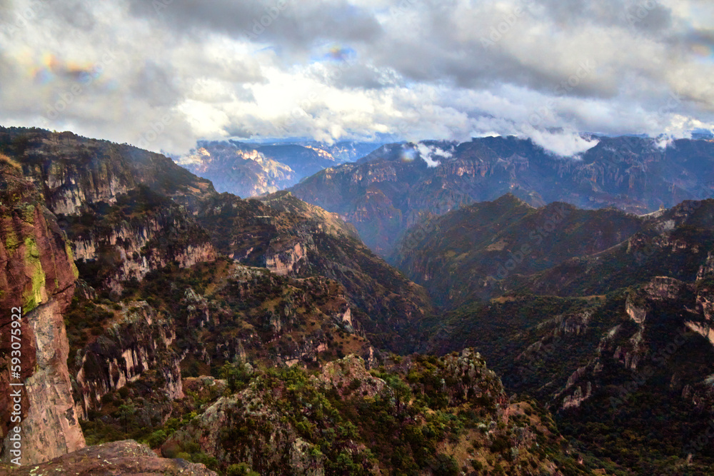 mountains in winter with cloudy sky , copper canyon with clouds of rain in divisadero, chihuahua mexico	