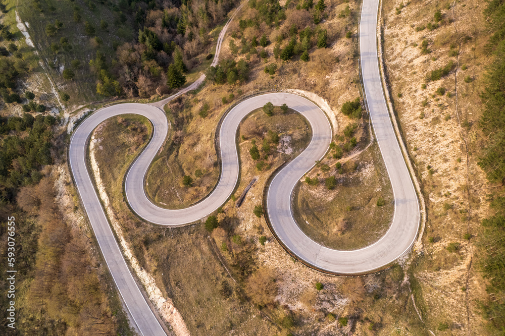 Aerial view of curvy road on monte Nerone slope in Marche region in Italy
