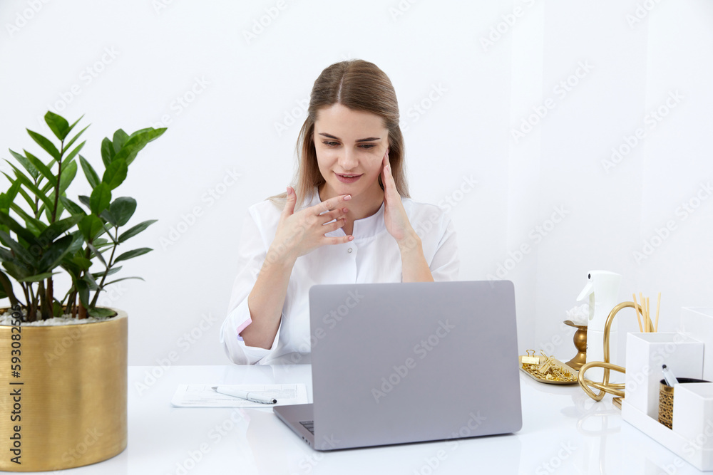 Female doctor make online video call consulting patient on laptop. Medical assistant young woman therapist videoconferencing to web camera. Telemedicine concept. Online doctor appointment. Female doctor make online video call consulting patient on laptop. Medical assistant young woman therapist videoconferencing to web camera. Telemedicine concept. Online doctor appointment.