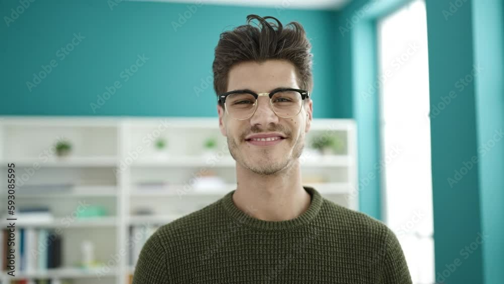 Young hispanic man student smiling confident standing at library university Young hispanic man student smiling confident standing at library university