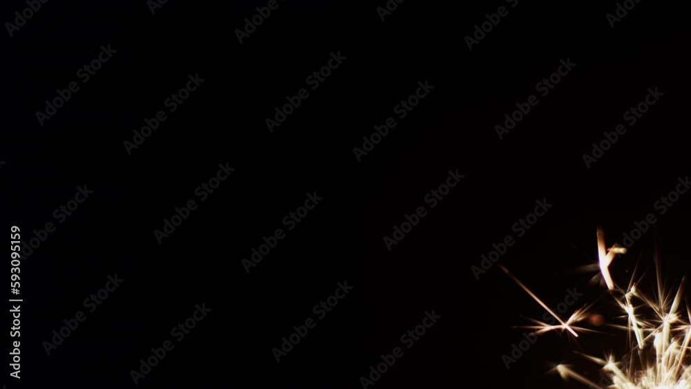 Burning Sparkler On The Bottom Right Side Of The Frame Burning Sparkler On The Bottom Right Side Of The Frame