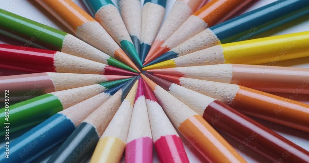 Colored pencils rotate in a circle. Close-up of colored pencils sharpened slow motion. Colored pencils rotate in a circle. Close-up of colored pencils sharpened slow motion.