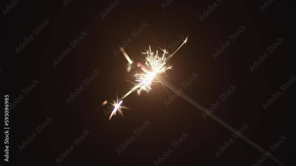 Close-up Of Sparkler Being Lit With A Candle Lighter