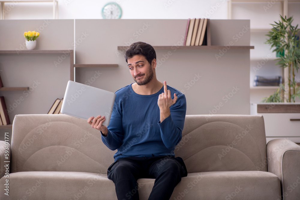 Young male freelancer working from home during pandemic Young male freelancer working from home during pandemic