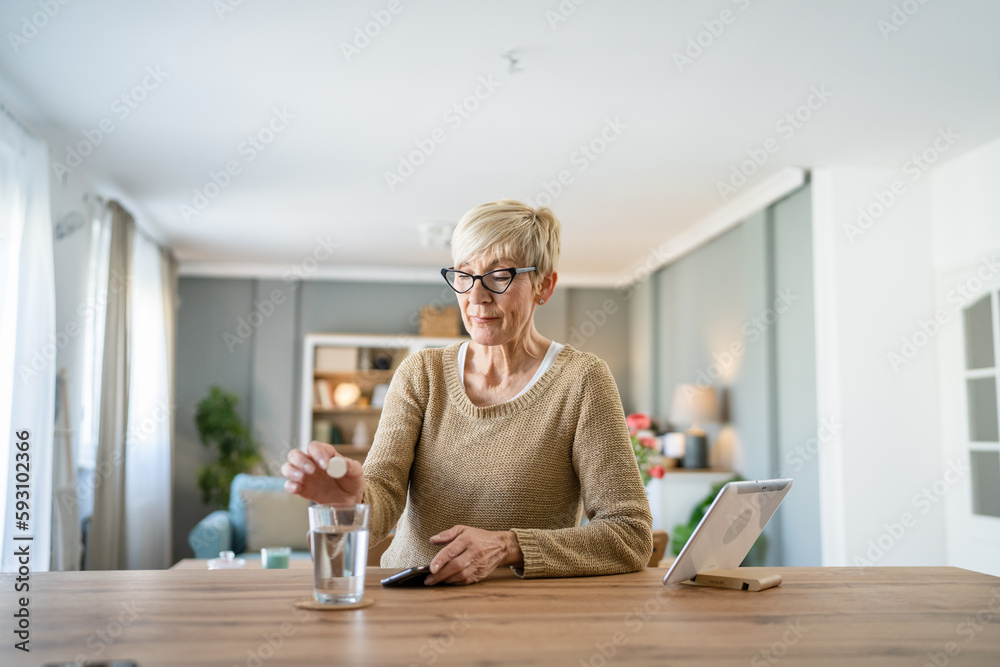 One senior caucasian woman take medicine drugs or supplement vitamin One senior caucasian woman take medicine drugs or supplement vitamin
