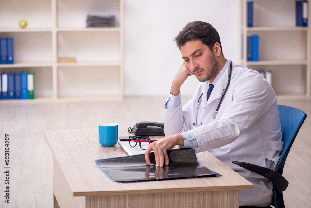 Young male doctor radiologist working in the clinic