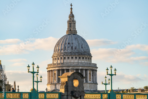 Dome of Saint Paul Cathedral behind Southwark bridge in London photo