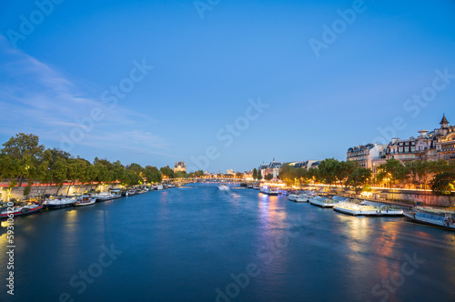 Night time view Paris with Seine river canal