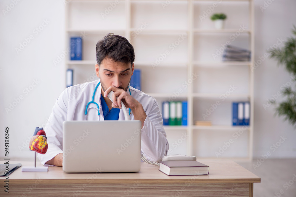 Fototapeta premium Young male doctor in telemedicine concept