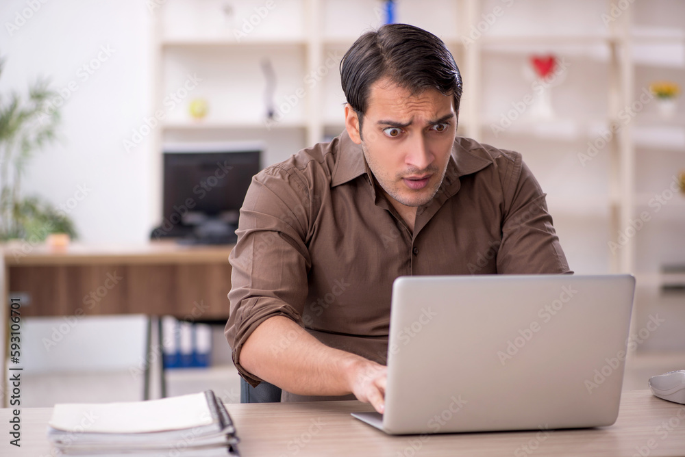 Young attractive employee sitting in the office Young attractive employee sitting in the office