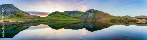 Llyn y Dywarchen and Beneath mounts at sunset in Snowdonia. Wales