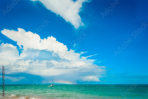 Blue sky over Tamandaré beach, with a burst of clouds