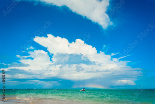 blue sky and a burst of white clouds