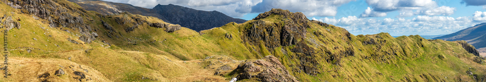 Pyg Track and Crib Goch peak panorama on sunny day in Snowdonia. Wales