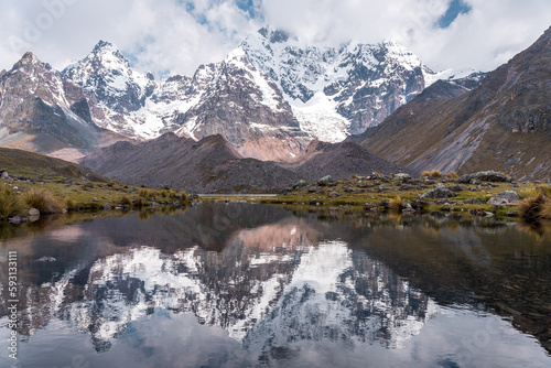 reflection of the snow-capped mountains in the lagoons of Ausangate, Cusco-Peru, South America, Andes
