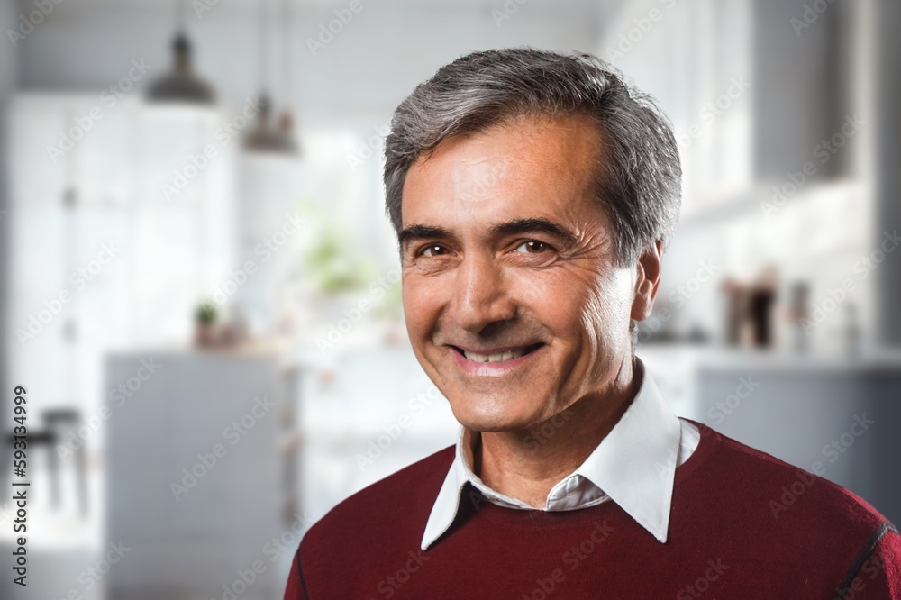 Naklejka premium Relax, happy elderly man posing in home