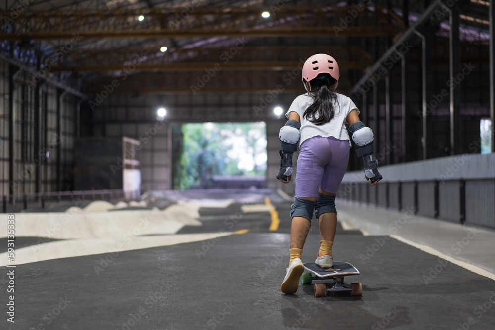 asian child skater or kid girl fun playing skateboard or start ride surf skate in indoor pump track skate park by extreme sports surfing to wears helmet elbow pads wrist knee guard for body safety asian child skater or kid girl fun playing skateboard or start ride surf skate in indoor pump track skate park by extreme sports surfing to wears helmet elbow pads wrist knee guard for body safety