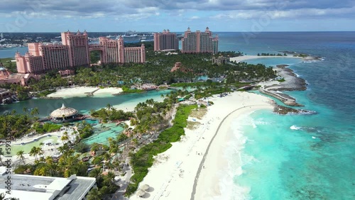 Beautiful cinematic aerial view of the Bahamas Beautiful cinematic aerial view of the Bahamas beaches with turquoise water ocean and people walking and enjoying the sand photo