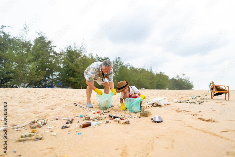 Group of Volunteers multiGeneration family picking up plastic trash