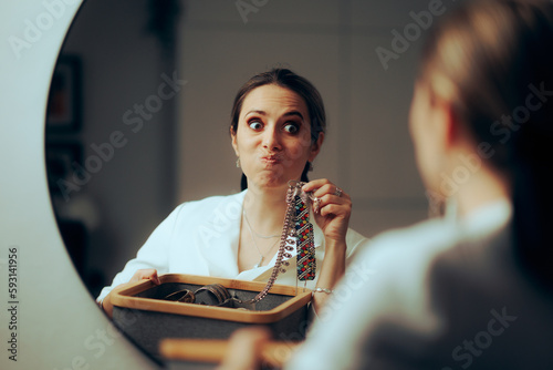 Woman looking in the Mirror Checking her Jewelry Box. Stylish snobbish lady choosing which necklace to wear 

 photo