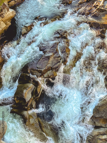 Waterfall in the Carpathian forest in Ukraine