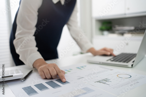 Businesswoman Accountant analyzing investment charts Invoice and pressing calculator buttons over documents. Accounting Bookkeeper Clerk Bank Advisor And Auditor Concept