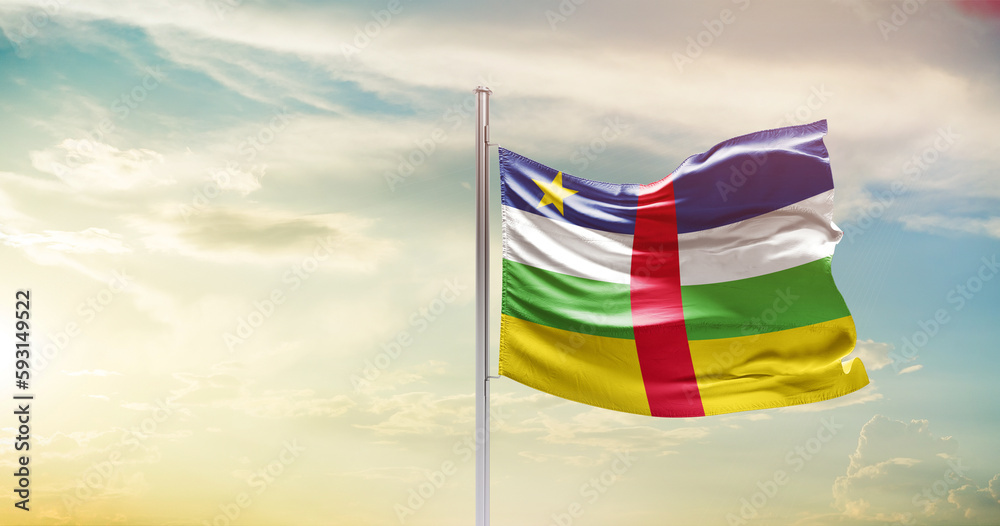 Central African Republic national flag waving in beautiful sky. The symbol of the state on wavy silk fabric.
