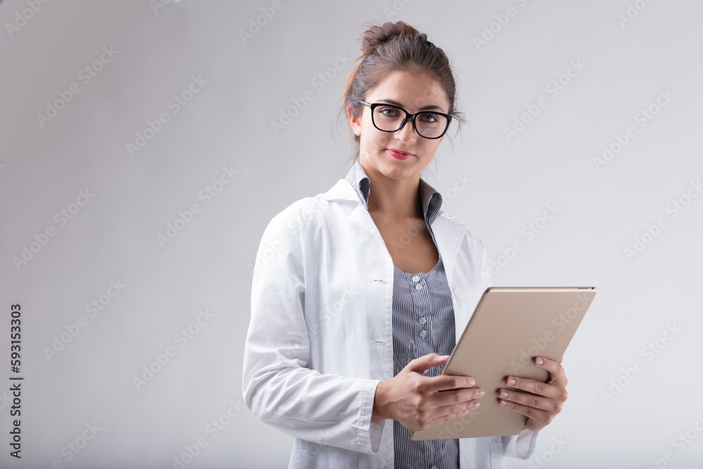 Professional woman, lab coat, glasses, digital tablet, confident