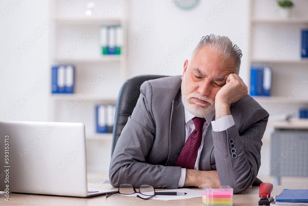 Old male employee and too much work in the office Old male employee and too much work in the office
