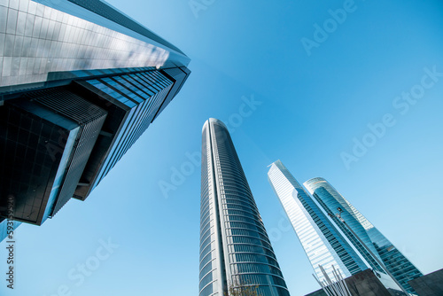 Cuatro Torres Business Area in Madrid with blue sky, spain