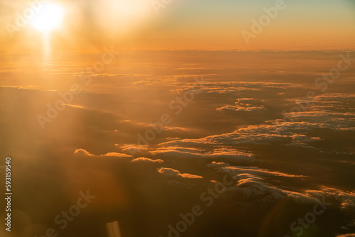 View from airplane over the clouds in Madrid, Spain by sunset © Cavan