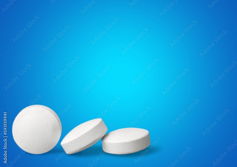 white medical pills lie on a color background. white medical pills lie on a color background.