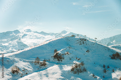 A mountain top overlooking ski slopes photo