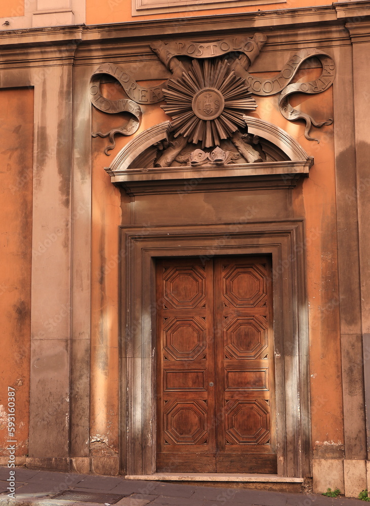 Via delle Quattro Fontane Street Former Church Facade Close Up with Wooden Entrance and Sculpted Details in Rome, Italy Via delle Quattro Fontane Street Former Church Facade Close Up with Wooden Entrance and Sculpted Details in Rome, Italy