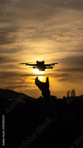 silhouette of a drone at sunset