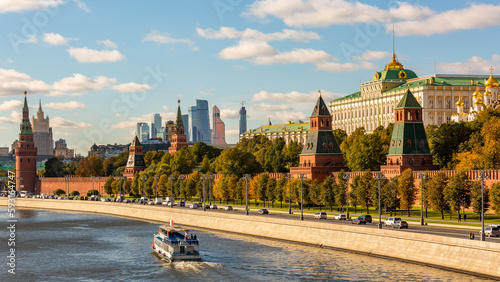 Moscow City with tourist boat in Moscow River, Moscow skyline with the historical architecture skyscraper, Aerial view tourist boat and bridge moskva river, Russia.