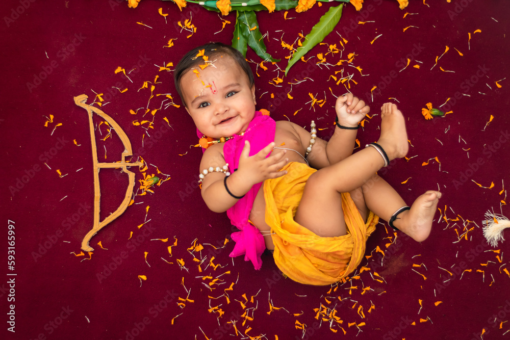 cute-indian-boy-dresses-as-lord-rama-with-bow-and-flowers-from-top