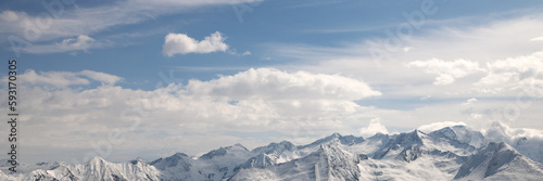 Banner 3x1 Alpine mountains and the sky in the clouds. photo