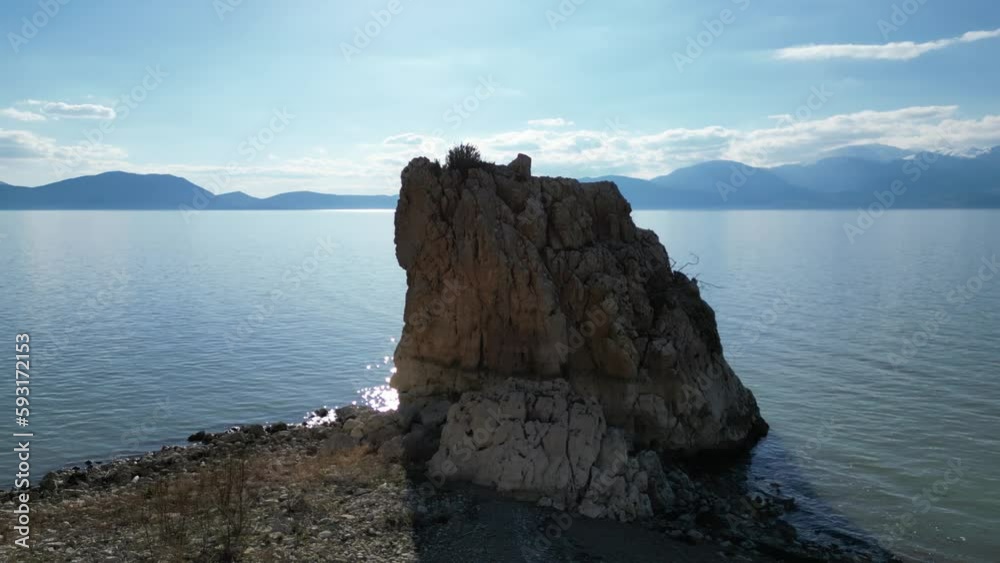 large mystical rock that accompanies the sunset view on the lake large mystical rock that accompanies the sunset view on the lake
