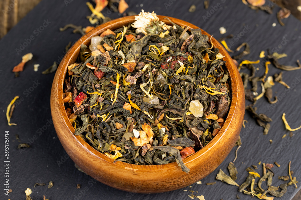 fresh green tea with pieces of fruit and berries fresh green tea with pieces of fruit and berries
