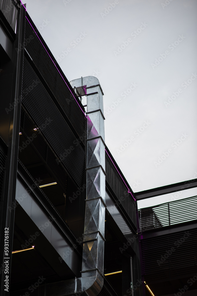 Fototapeta premium The BBQ restaurant ventilation system with airflow fan, air duct and pipe for ventilate vacuum odor and smoke from the kitchen and BBQ tables to outdoor in a modern shopping mall area.