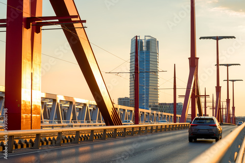 Car on the bridge at sunset photo