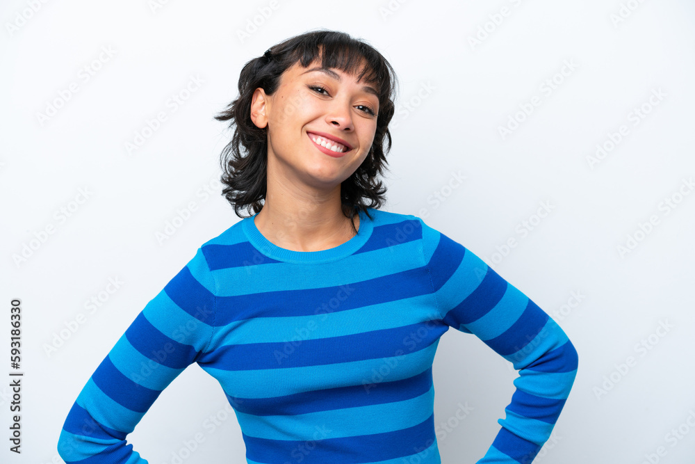 Young Argentinian woman isolated on white background posing with arms at hip and smiling Young Argentinian woman isolated on white background posing with arms at hip and smiling