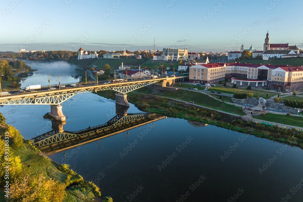 aerial view from great height on wide river and huge bridge of old city