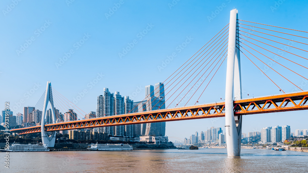 City skyline scenery with tall buildings and Dongshuimen Bridge in Chongqing, China