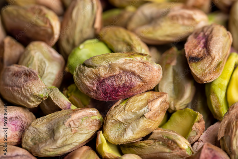 Crispy delicious pistachios with salt on the table Crispy delicious pistachios with salt on the table