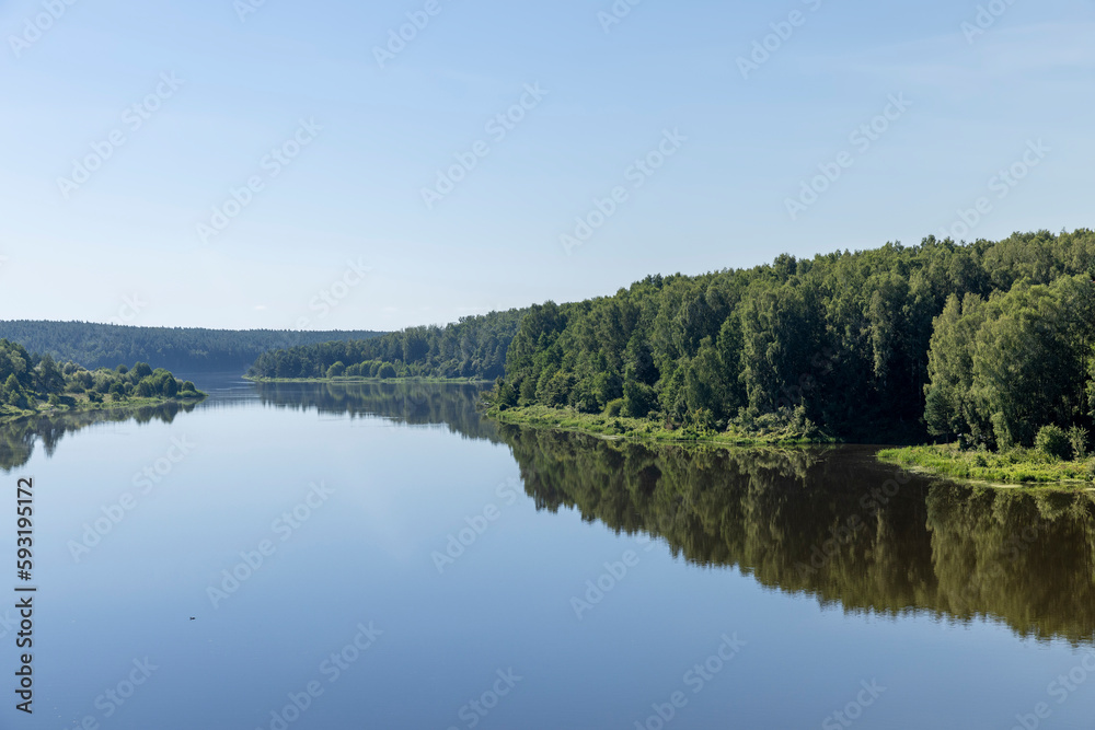 Wide river in summer in sunny weather