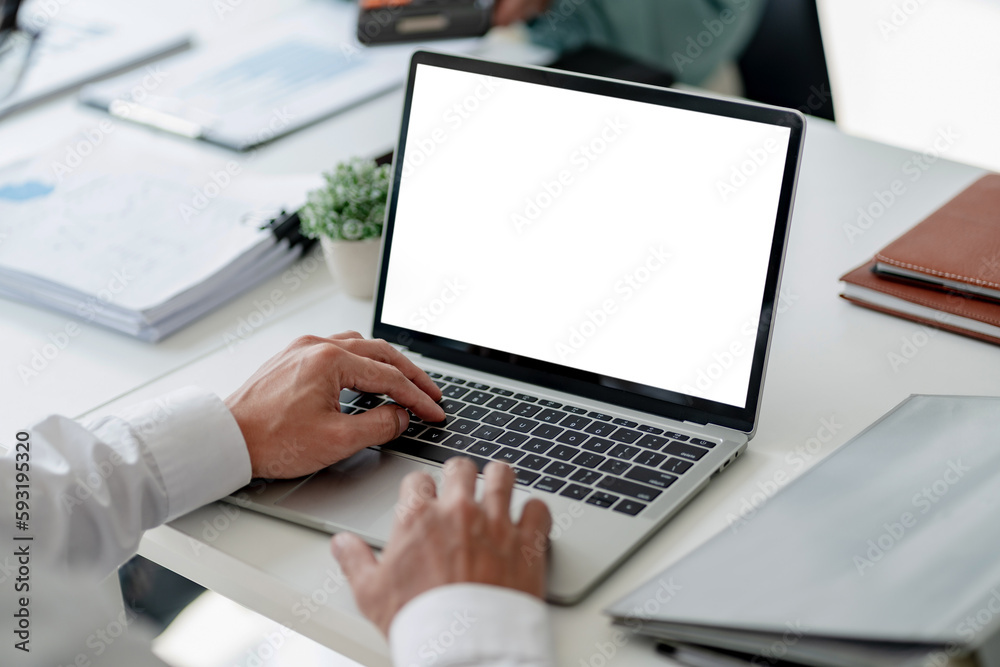 Group of business people is discussing in the office about the company profit figures.. Group of business people is discussing in the office about the company profit figures..