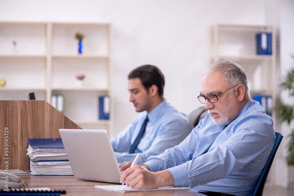 Two male colleagues working in the office Two male colleagues working in the office